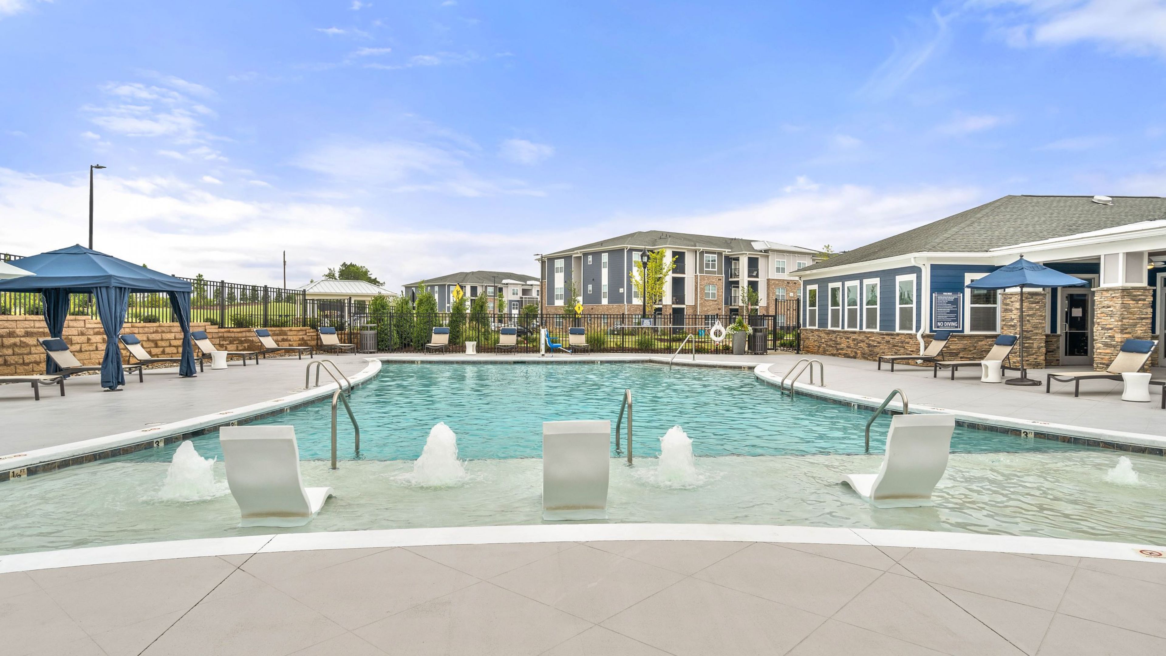 luxurious outdoor pool with lounge seating